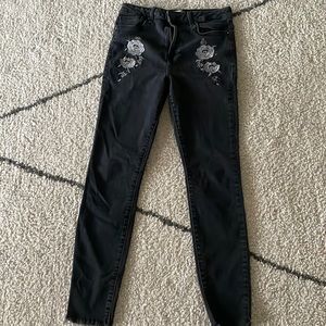 These jeans are the brand forever 21,the color black with flowers on them